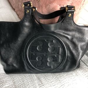 Tory Burch Black Leather purse with embossed Logo.